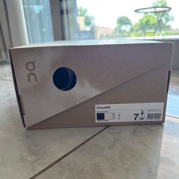 On Running White and Black Sneakers with Sleek Design - Picture 2 of 8